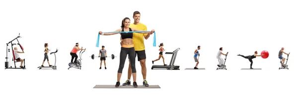 Male fitness instructor with a young female and people exercisin — Stock Photo, Image