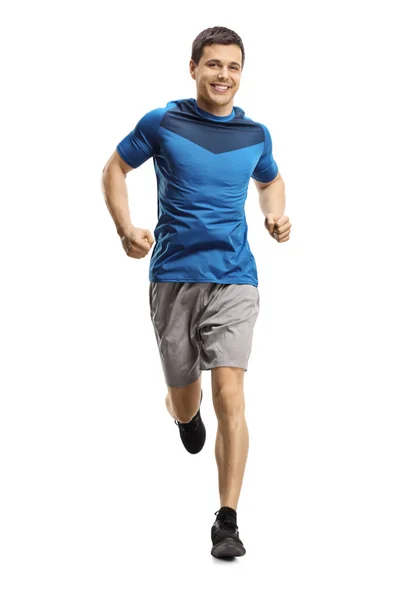 Young man jogging towards the camera — Stockfoto