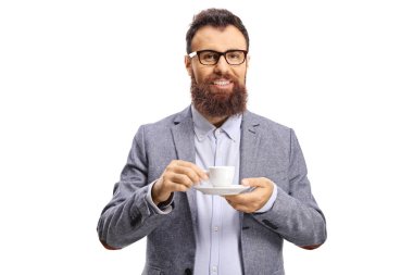 Cheerful bearded man with a cup of espresso coffee looking at th