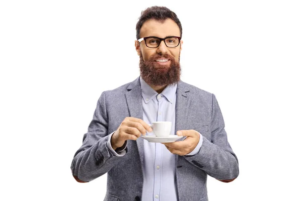 Cheerful bearded man with a cup of espresso coffee looking at th — Stok fotoğraf