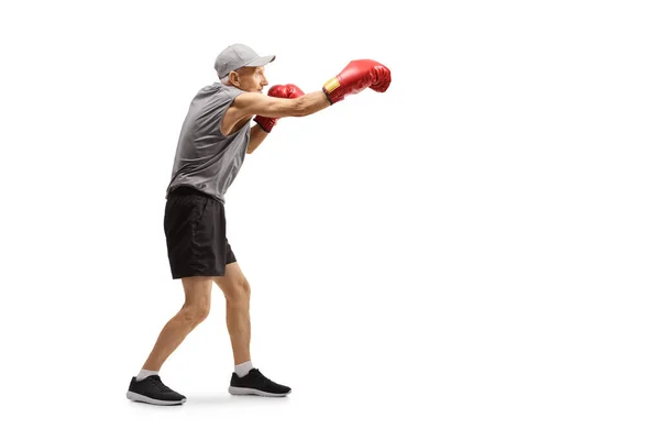 Anciano con puñetazos con guantes de boxeo —  Fotos de Stock