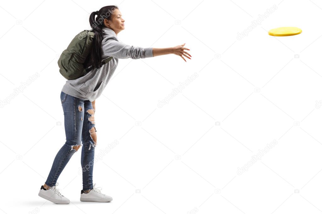 Female student throwing a plastic disc 