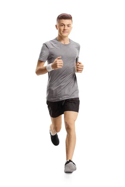 Young guy jogging towards the camera — Stock Photo, Image