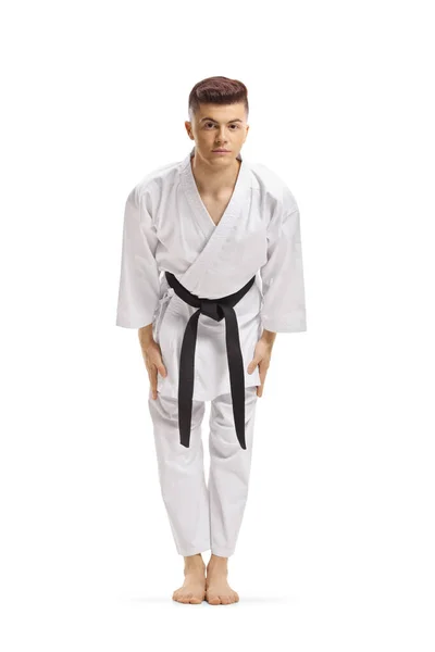 Jonge jongen in karate kimono buigen — Stockfoto