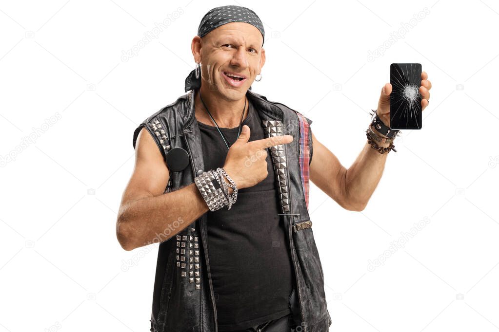Punker pointing to a smartphone with a broken screen