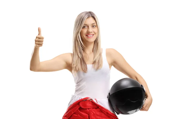 Young female race driver holding her thumb up — Stock Photo, Image