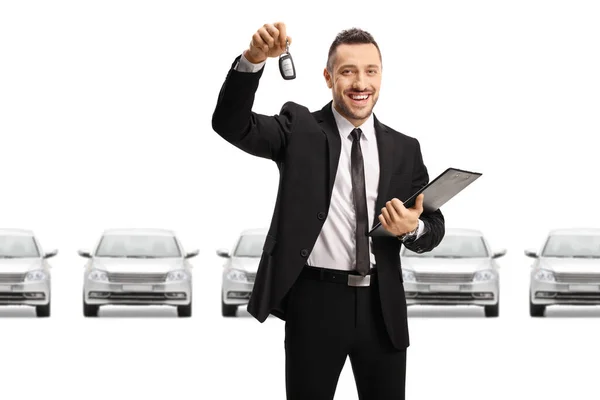 Car Dealer Holding Car Key Documents Front Silver Cars Isolated — Stock Photo, Image