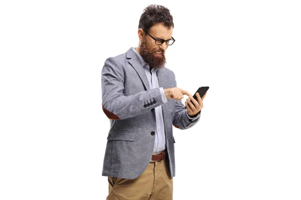 Annoyed bearded man typing on a mobile phone isolated on white background