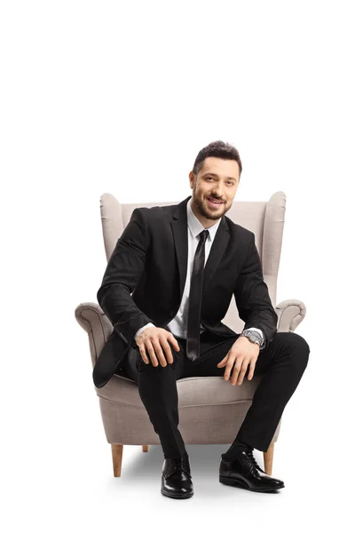Hombre Profesional Traje Sonriendo Sentado Sillón Aislado Sobre Fondo Blanco —  Fotos de Stock