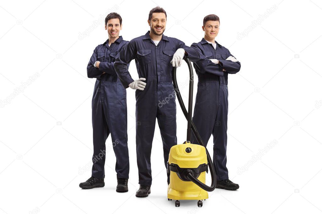 Full length portrait of male cleaners with a vacuum cleaner isolated on white background