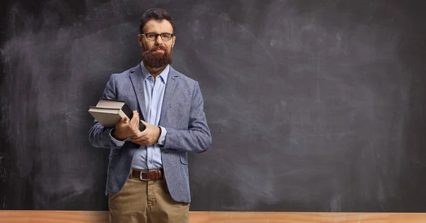 Beareded Male Teacher Holding Books Standing Front Blackboard Classroom — Stock Photo, Image