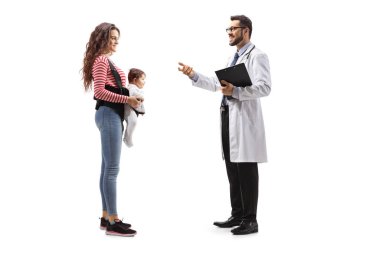 Full length profile shot of a mother with a baby in a carrier talking to a male pediatrician doctor isolated on white background  clipart