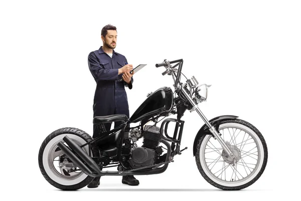 Full Length Portrait Motorcycle Mechanic Uniform Writing Document Chopper Motorbike — Stock Photo, Image