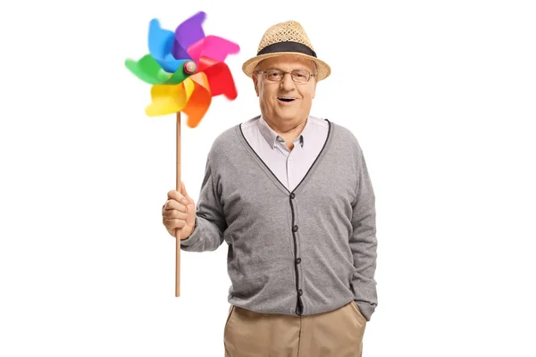 Šťastný Starší Pán Drží Rotující Větrník Izolované Bílém Pozadí — Stock fotografie