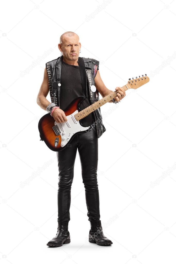 Full length portrait of a punk rocker with an electric guitar isolated on white background