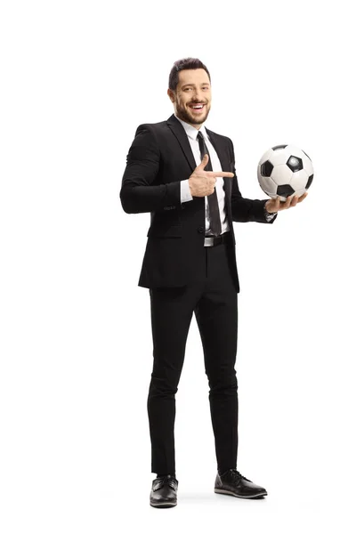 Full Length Portrait Man Black Suit Holding Football Pointing Isolated — Stock Photo, Image