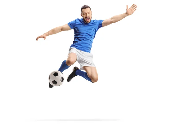 Futbolista Saltando Pateando Una Pelota Aislada Sobre Fondo Blanco — Foto de Stock