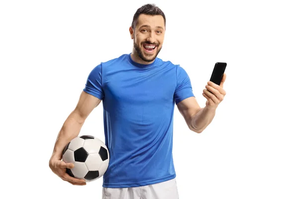 Jugador Fútbol Sosteniendo Una Pelota Teléfono Móvil Sonriendo Cámara Aislada —  Fotos de Stock