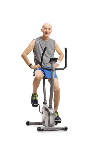 Elderly Man Sportswear Sitting Exercise Bike Smiling Isolated White Background — Stock Photo, Image