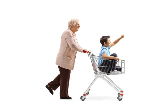 Full Length Profile Shot Grandmother Pushing Shopping Cart Happy Boy — Stock Photo, Image