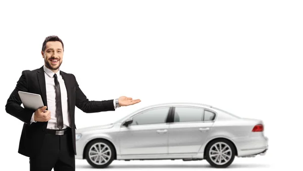 Car Salesman Holding Digital Tabler Showing Silver New Car Isolated — Stock Photo, Image