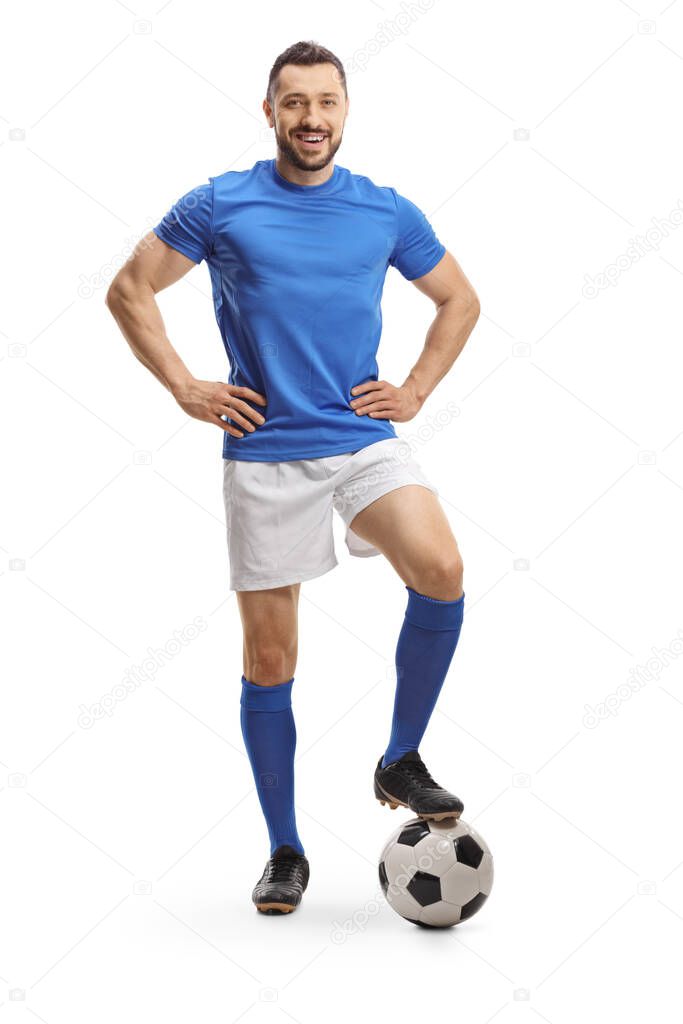 Full length portrait of a cheerful soccer player posing with a ball isolated on white background