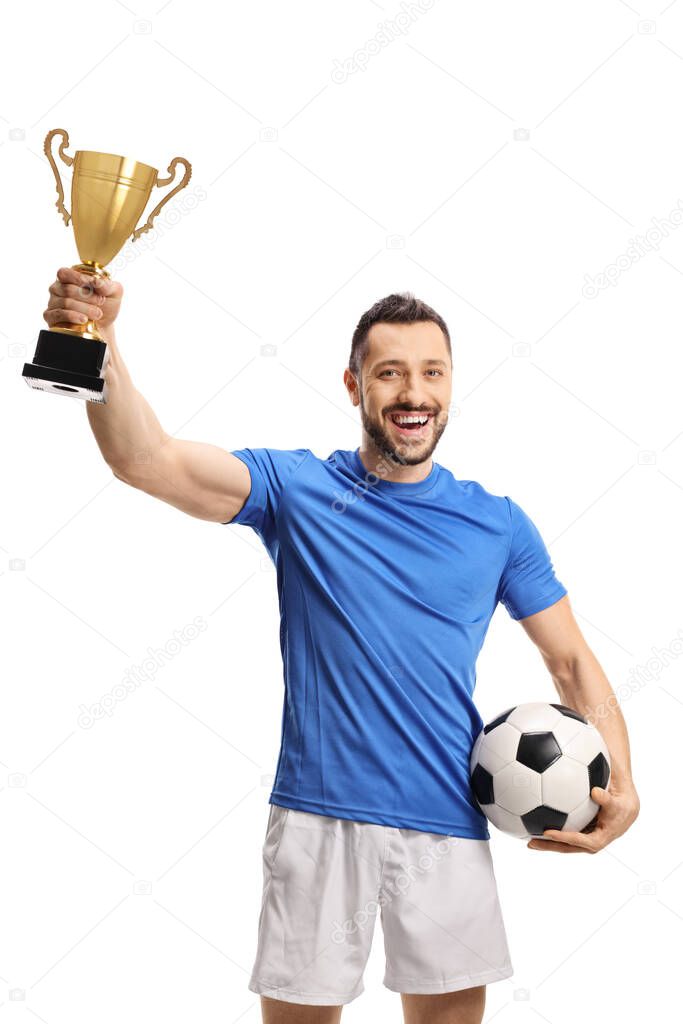 Soccer player holding a ball and a golden trophy cup isolated on white background