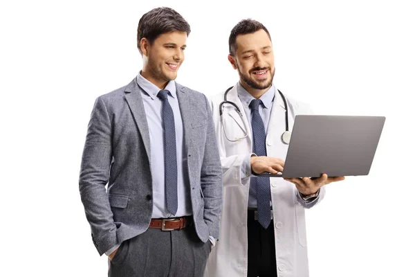 Doctor Showing Something Man Suit Laptop Computer Isolated White Background — Stock Photo, Image