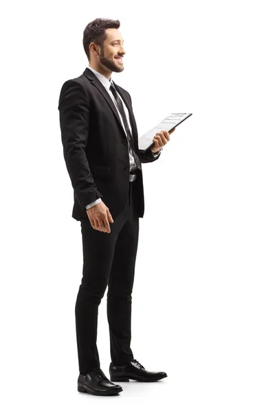 Full Length Profile Shot Elegant Man Black Suit Holding Clipboard — Stock Photo, Image