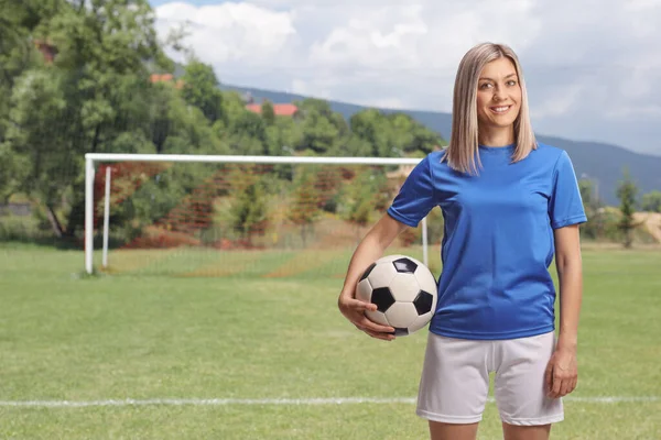 Female Soccer Player Holding Ball Arm Standing Football Pitch — Stock Photo, Image
