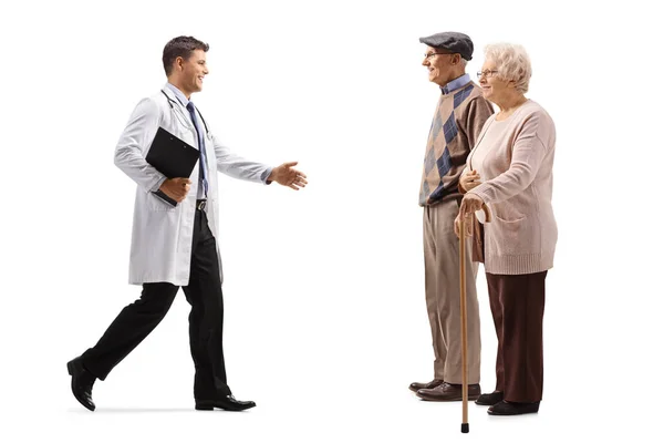 Full Length Profile Shot Male Health Worker Welcoming Elderly Patients — Stock Photo, Image