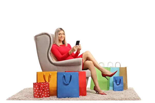 Young Woman Armchair Mobile Phone Shopping Bags Isolated White Background — Stock Photo, Image