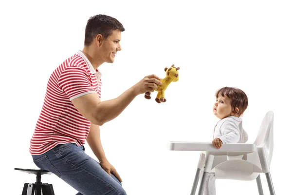 Vader Spelen Met Een Baby Een Stoel Geïsoleerd Witte Achtergrond — Stockfoto
