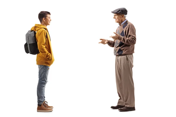 Full Length Profile Shot Elderly Man Talking His Teenage Grandson — Stock Photo, Image