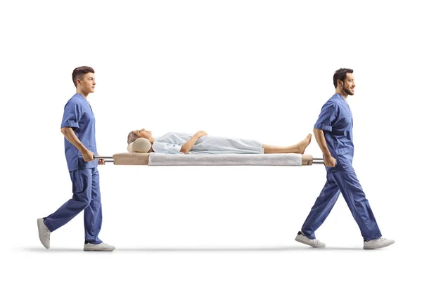 Full Length Profile Shot Healthcare Workers Carrying Female Patient Stretcher — Stock Photo, Image