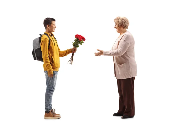 Full Length Profile Shot Male Teenager Giving Bunch Red Roses — Stock Photo, Image