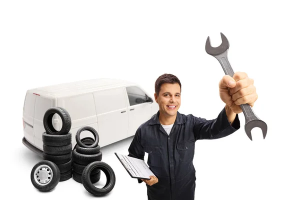 Auto Mechanic White Van Pile Tires Holding Key Wrench Isolated — Stock Photo, Image