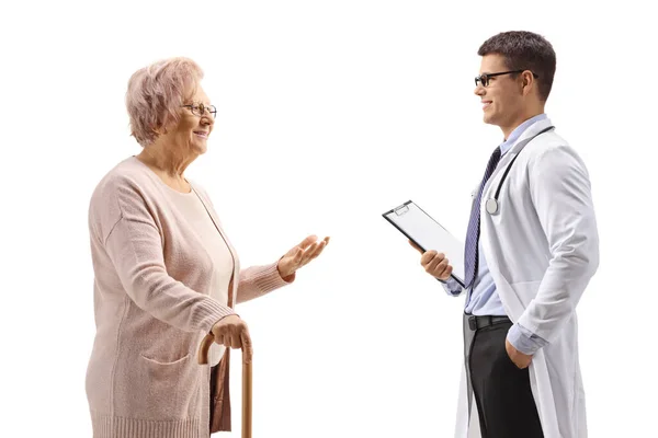 Female Pensioner Cane Talking Young Male Doctor Isolated White Background — Stock Photo, Image