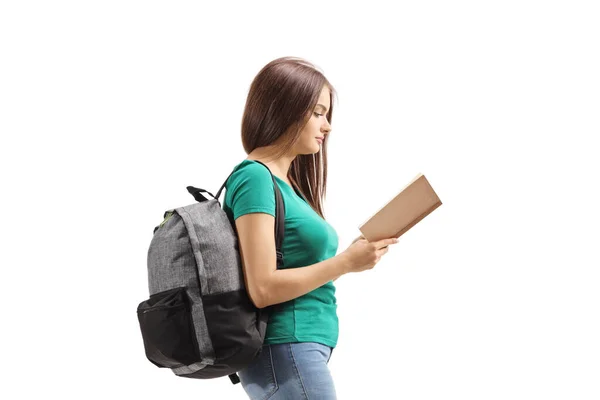 Young Female Backpack Reading Book Walking Isolated White Background — Stock Photo, Image