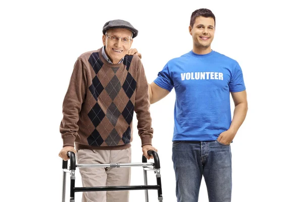 Vrijwilliger Helpen Van Een Senior Man Met Een Walker Geïsoleerd — Stockfoto