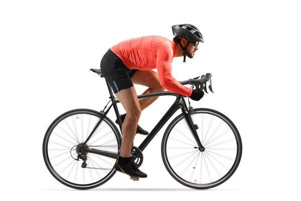 Profile shot of a male cyclist riding a road bicycle with spinning wheels isolated on white background