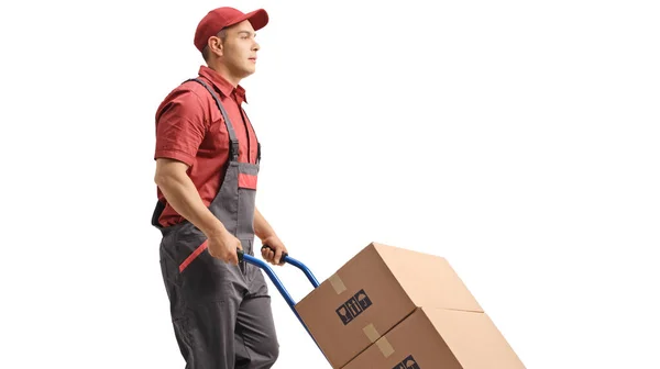 Werknemer Een Uniform Duwen Dozen Een Handtruck Geïsoleerd Witte Achtergrond — Stockfoto