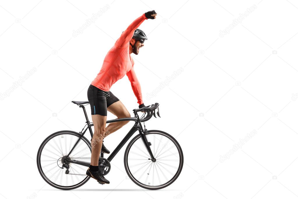 Male cyclist riding a road bicycle and gesturing win with hand isolated on white background