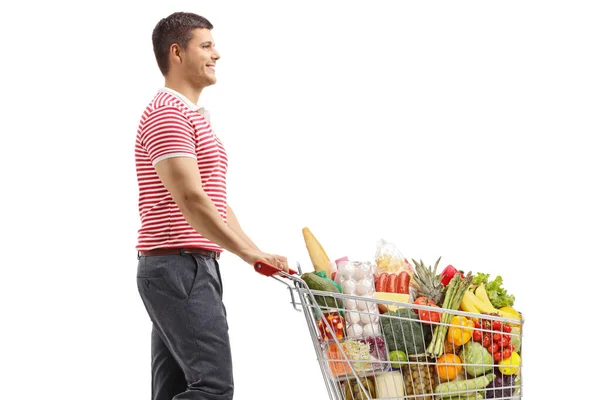 Man Walking Pushing Full Shopping Cart Isolated White Background — Stock Photo, Image