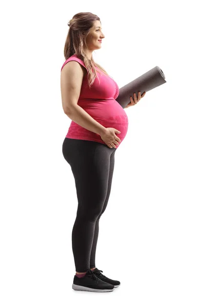 Full Length Profil Záběr Těhotné Ženy Stojící Držící Rohožku Izolované — Stock fotografie