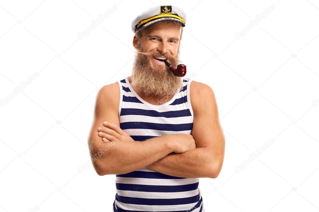 Smiling young sailor with a pipe and blond beard isolated on white background