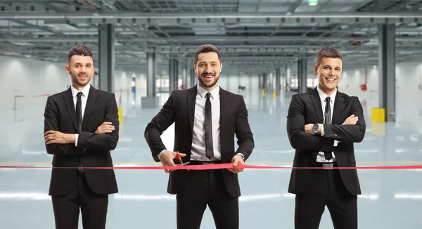 Businessmen Cutting Red Ribbon Tape Opening Factory Hall — Stock Photo, Image