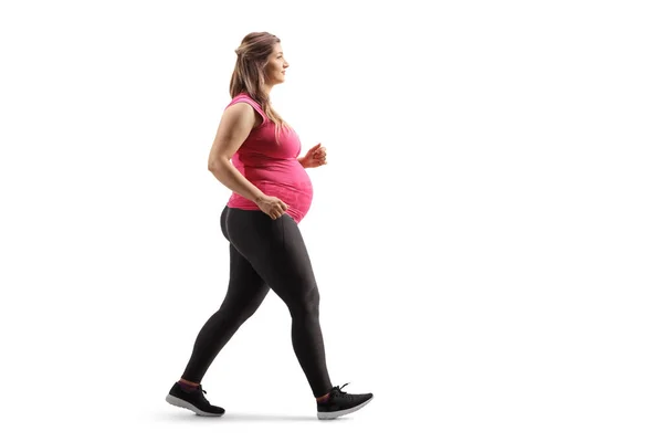 Volledig Profiel Shot Van Een Zwangere Vrouw Sportkleding Lopen Geïsoleerd — Stockfoto