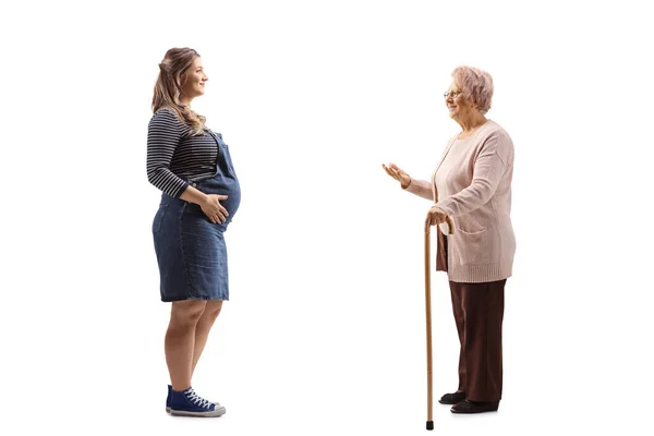 Full Length Profile Shot Pregnant Woman Elderly Lady Having Conversation — Stock Photo, Image