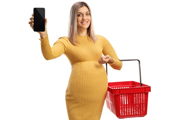 Femme Enceinte Souriante Tenant Panier Montrant Smartphone Isolé Sur Fond — Photo